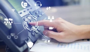 VoIP vs. Traditional Phones visual showing business user interacting with modern VoIP phone system featuring cloud-based calling, analytics, and device integration.